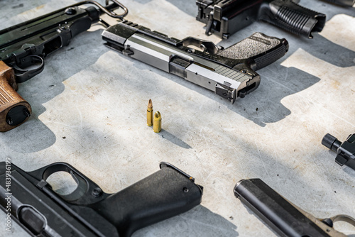 pistols and bullets on the table