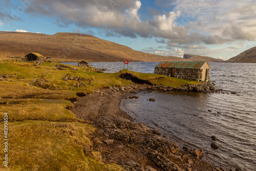 Old stone buildings for storing boats, Faroe Islands.