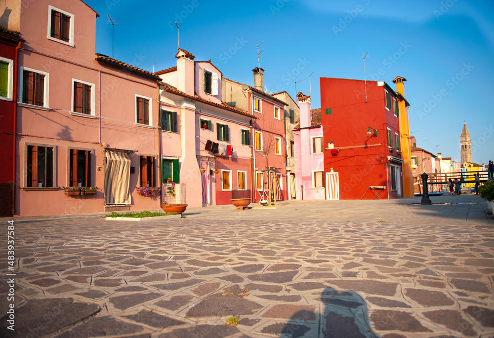 VENICE, ITALY: Burano island, architectural details of multi-colored houses of locals. Traditional colorful houses - one of attractive tourist objects in the Venetian lagoon