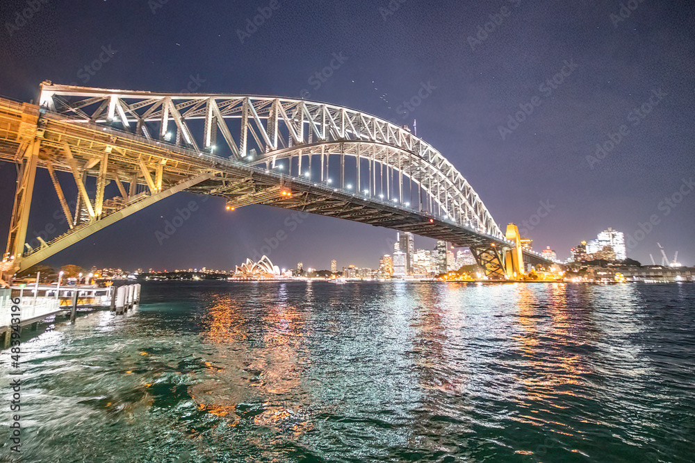 Sydeny Harbour Bridge at night, view from a moving tourist boat