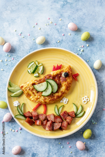 Funny chick egg omelette with ham vegetables for kids breakfast for Easter
