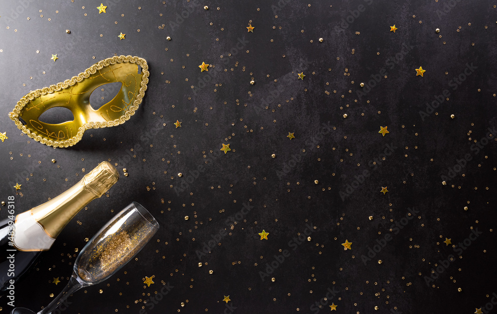 Happy Purim carnival decoration concept made from golden mask, wine