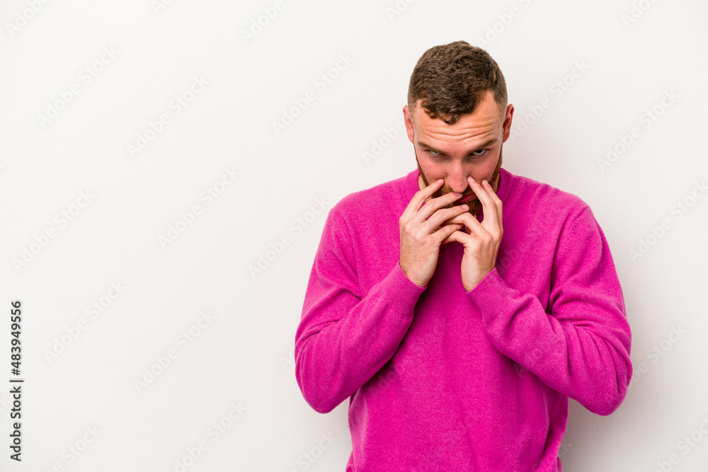 Young caucasian man isolated on white background making up plan in mind, setting up an idea. Young caucasian man isolated on white background making up plan in mind, setting up an idea.