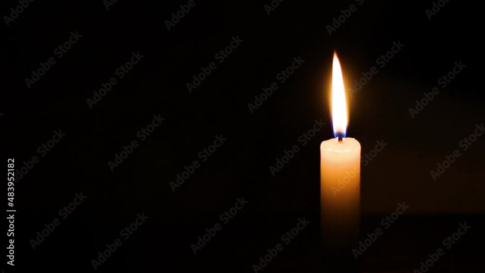 Burning candle in the dark Burning candle in the dark