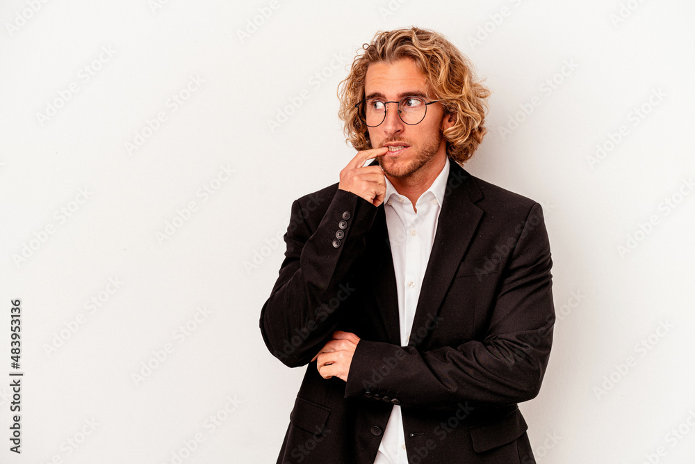 Young caucasian business man isolated on white background relaxed thinking about something looking at a copy space.