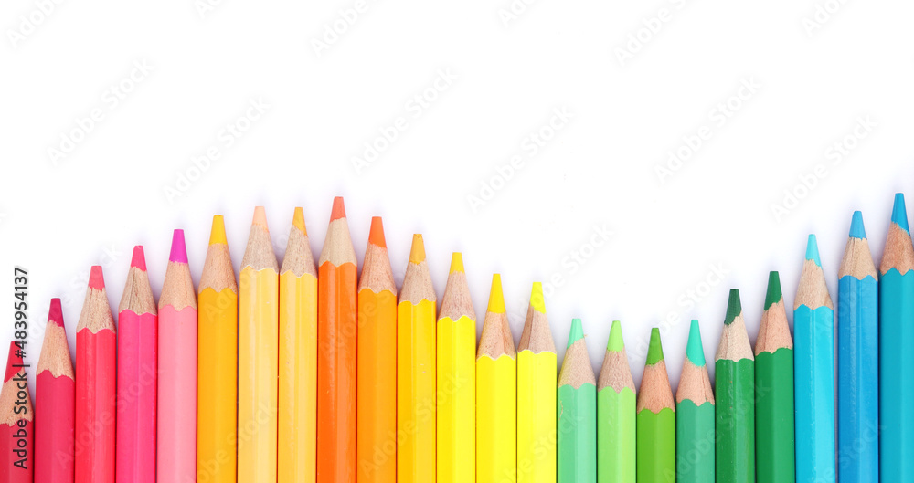 Colored pencils with isolated copy space on white background, educational frame concept. Colored pencils with isolated copy space on white background, educational frame concept.
