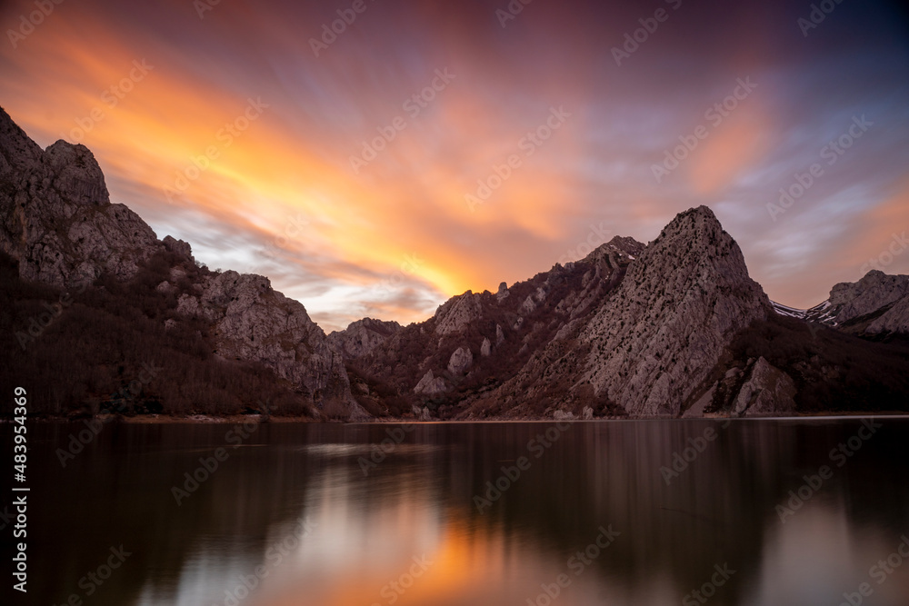 red sunset in a mountain lake