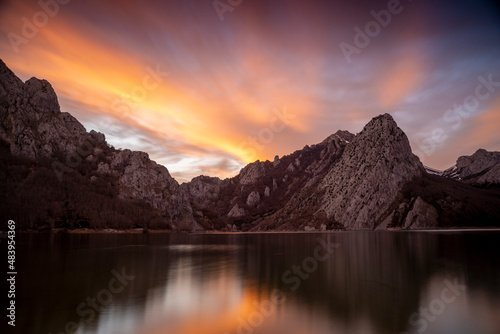 red sunset in a mountain lake