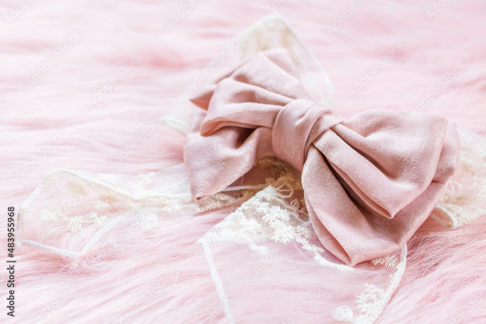 Pink ribbon on a pink fabric with copyspace. Pink ribbon on a pink fabric with copyspace.