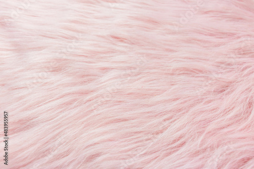 Top view of pink fur texture, pink sheepskin background.