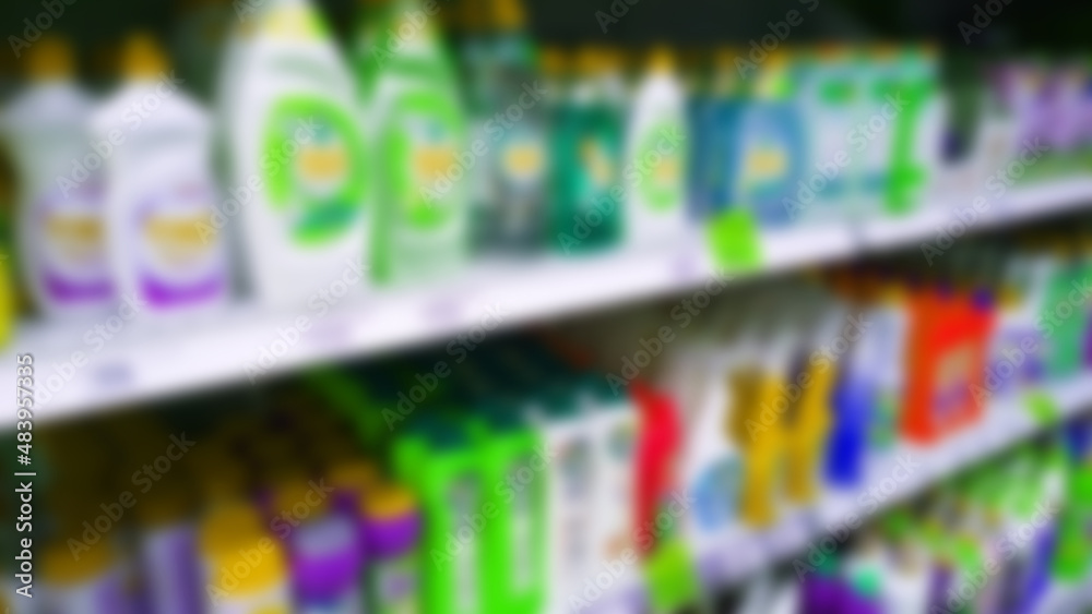 Abstract blur image of supermarket background. Defocused shelves with detergent, washing powder, soap, cleanser. Store. Retail industry. Shelf. Discount price. Inflation. Economic crisis concept. Abstract blur image of supermarket background. Defocused shelves with detergent, washing powder, soap, cleanser. Store. Retail industry. Shelf. Discount price. Inflation. Economic crisis concept.