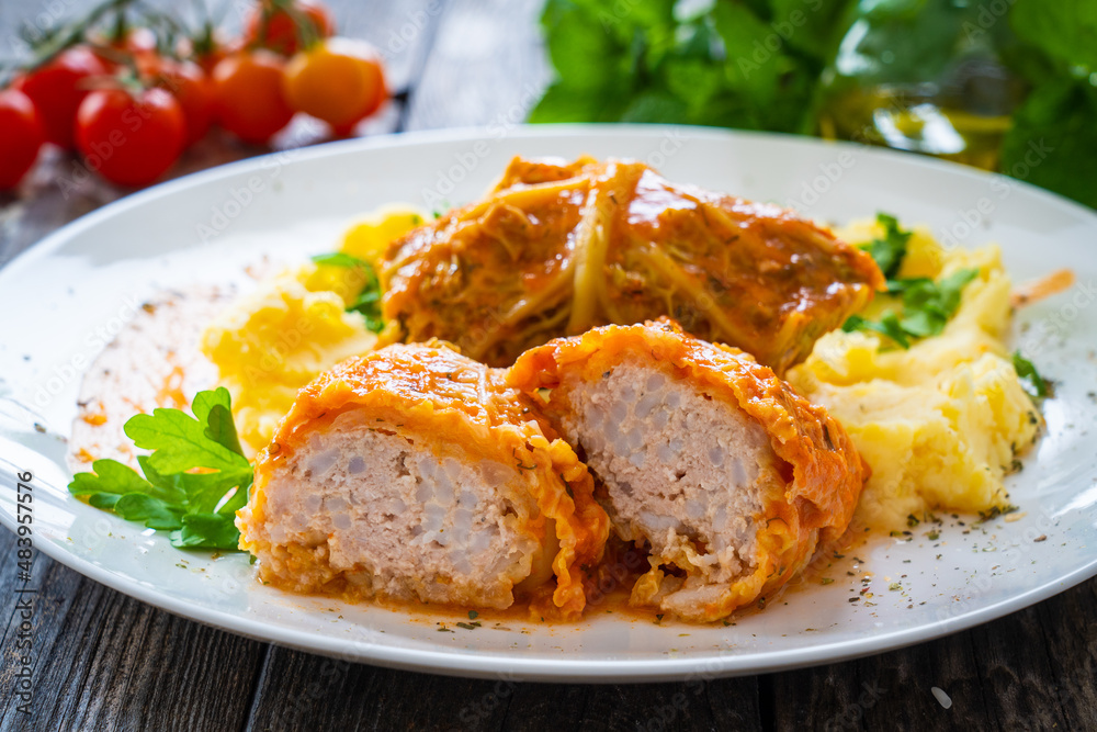 Wrapped minced meat in cabbage leaves and mashed potatoes - polish dish gołąbki
