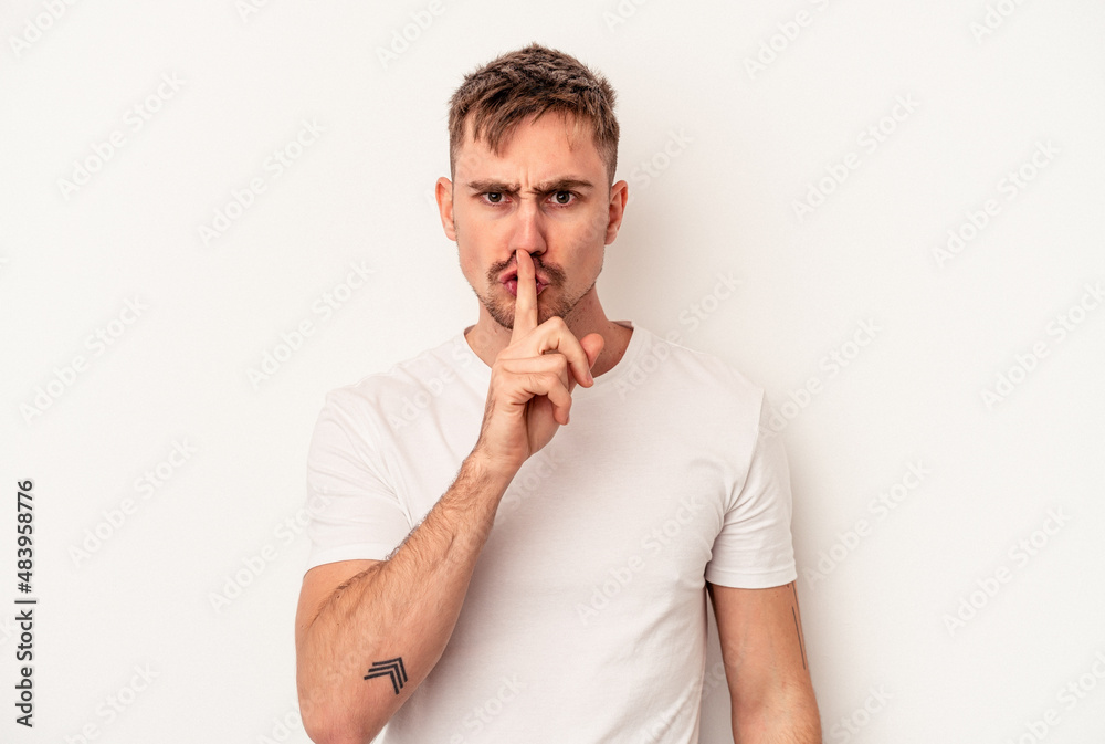 Young caucasian man isolated on white background showing a timeout gesture. Young caucasian man isolated on white background showing a timeout gesture.