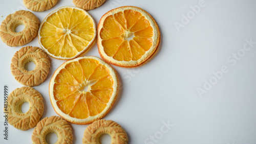 round-shaped cookies and round dry orange slices 