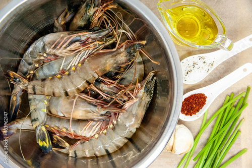 Large raw uncooked prawns or langoustines in shell.