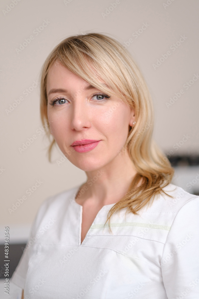 Portrait of a young beautiful woman cosmetologist in the interior of a beauty salon. Portrait of a young beautiful woman cosmetologist in the interior of a beauty salon.