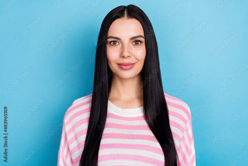 Portrait of attractive cheery long-haired brunet girl wearing jumper isolated over bright blue color background Portrait of attractive cheery long-haired brunet girl wearing jumper isolated over bright blue color background