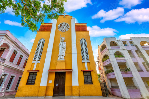Photography Saint Eugene Catholic Cathedral (yellow building) in Ciego de Avila, Cuba