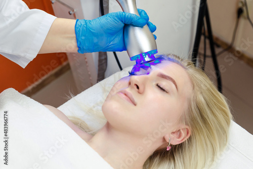 Cryotherapy for facial skin rejuvenation in a beauty salon.