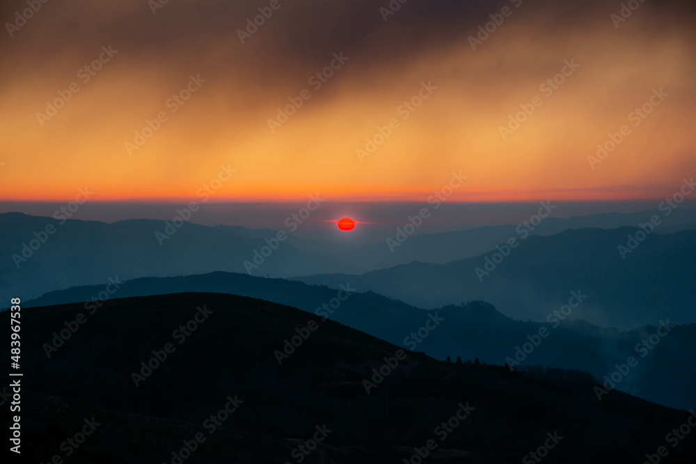 Sunset, with impressive red sunset color in the north of Portugal, caused by smoke from authorized burning in February 2022 Sunset, with impressive red sunset color in the north of Portugal, caused by smoke from authorized burning in February 2022