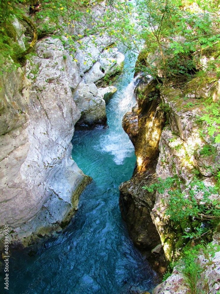 Soca rive at the Great Soca gorge waterfalls in Trenta valley in