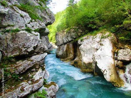 River Soca flowing through the Great Soca gorge tourist attraction in Trenta valley, Slovenia
