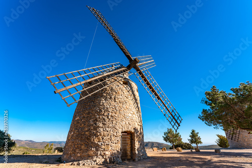 Traditional stone windmills on top of a hill in Alcublas, Valencia, Spain