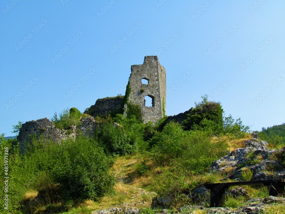 Ruins of Vipava castle with shrubs vegetation and path leading to the castle in Littoral region of Slovenia Ruins of Vipava castle with shrubs vegetation and path leading to the castle in Littoral region of Slovenia