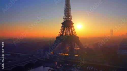 sunset behind eiffeltower in Paris photo