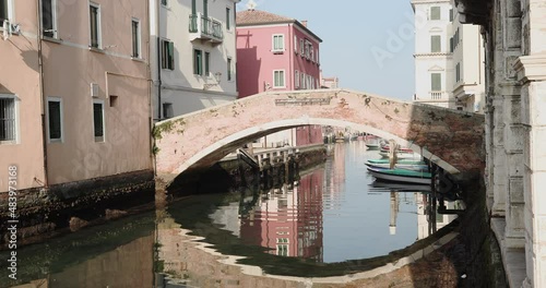 Chioggia town in venetian lagoon, water canal. Chioggia is a seaside town south of Venice, Italy. Traversed by the Corso del Popolo thoroughfare, its historic area has canals and narrow alleys.