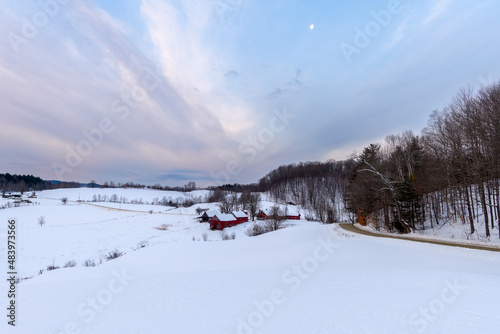 Photograph of a farm during a winter sunrise