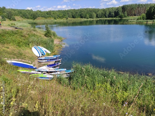 saps lie on the shore of the lake photo