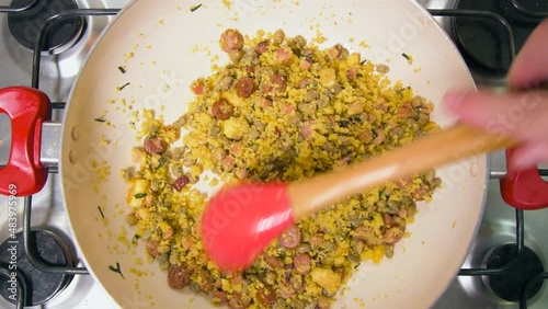 Northeastern Feijao Tropeiro, brazilian dish made with cuscuz, string bean, sausage, bacon, chive and curd cheese. Zoom in effect.