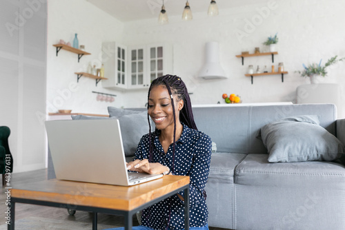 Beautiful young black woman has a zoom call remote work or study online in from laptop classes