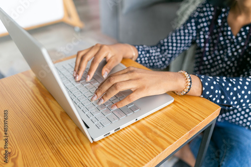 Beautiful young black woman study or works from laptop online remote work university classes