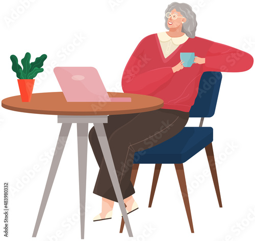 Senior woman drinking coffee and using laptop. Elderly lady is freelancing, working on computer at workplace. Coffee drinking, rest during break at work. Female character sitting at table and working