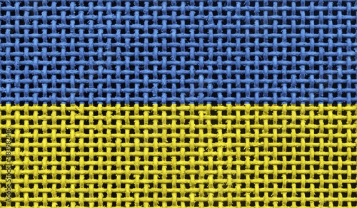 Ukraine flag on the surface of a metal lattice. 3D image