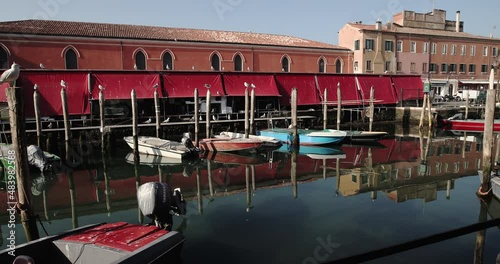 Chioggia town in venetian lagoon, water canal. Chioggia is a seaside town south of Venice, Italy. Traversed by the Corso del Popolo thoroughfare, its historic area has canals and narrow alleys.