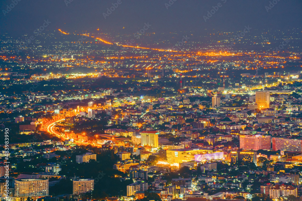 A long exposure photo taken from Chiang Mai, Top view of Chiang Mai cityscape at night, night time panorama building tourist amazing