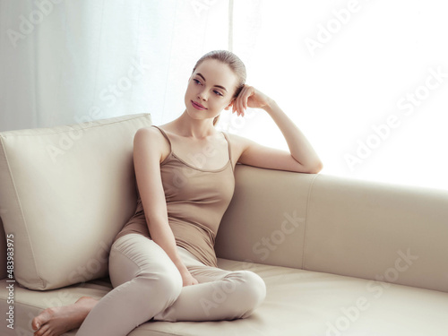 Woman home portrait sofa relax female indoors portrait