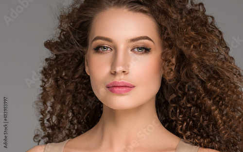 Curly hair woman beautiful beauty portrait, female glamour face with long brunette hairstyle