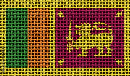 Sri Lanka flag on the surface of a metal lattice. 3D image