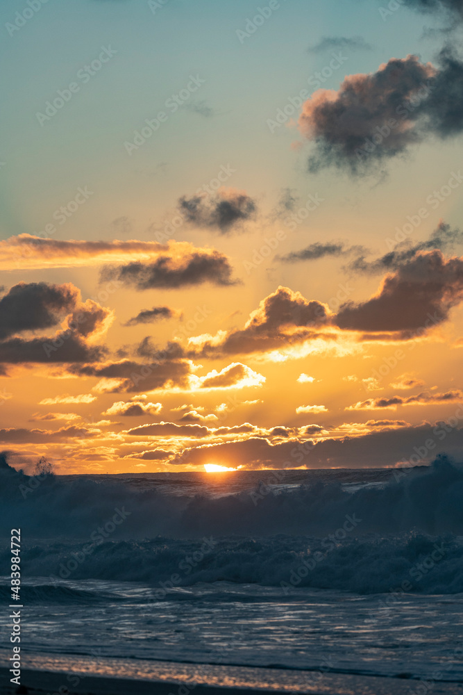 Fototapeta premium Misty Sunset over Waves on North Shore of Oahu