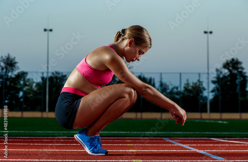 Runner sprinting towards success on run path running athletic track. Goal achievement concept.