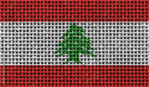 Lebanon flag on the surface of a metal lattice. 3D image