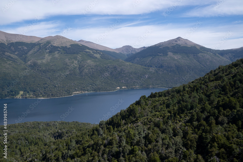 View of the forest and hills around the deep blue water lake Gutierrez in Bariloche, Patagonia Argentina. View of the forest and hills around the deep blue water lake Gutierrez in Bariloche, Patagonia Argentina.