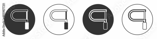 Black Hacksaw icon isolated on white background. Metal saw for wood and metal. Circle button. Vector