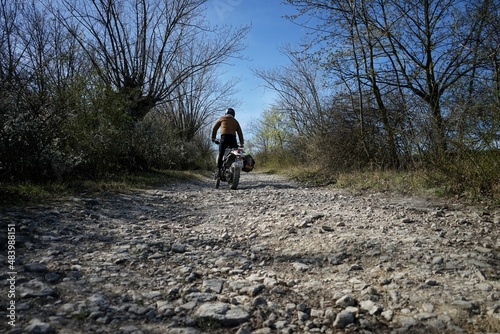 Motorcycle rider on a gravel road