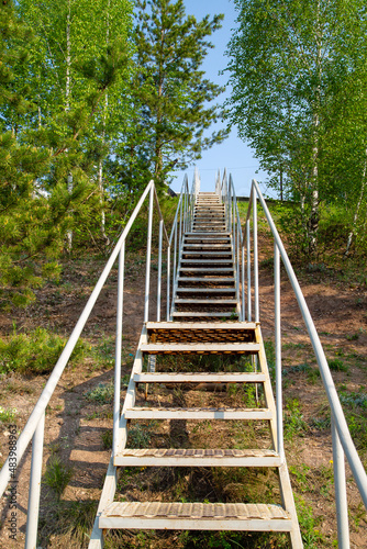 iron staircase leading to the blue sky