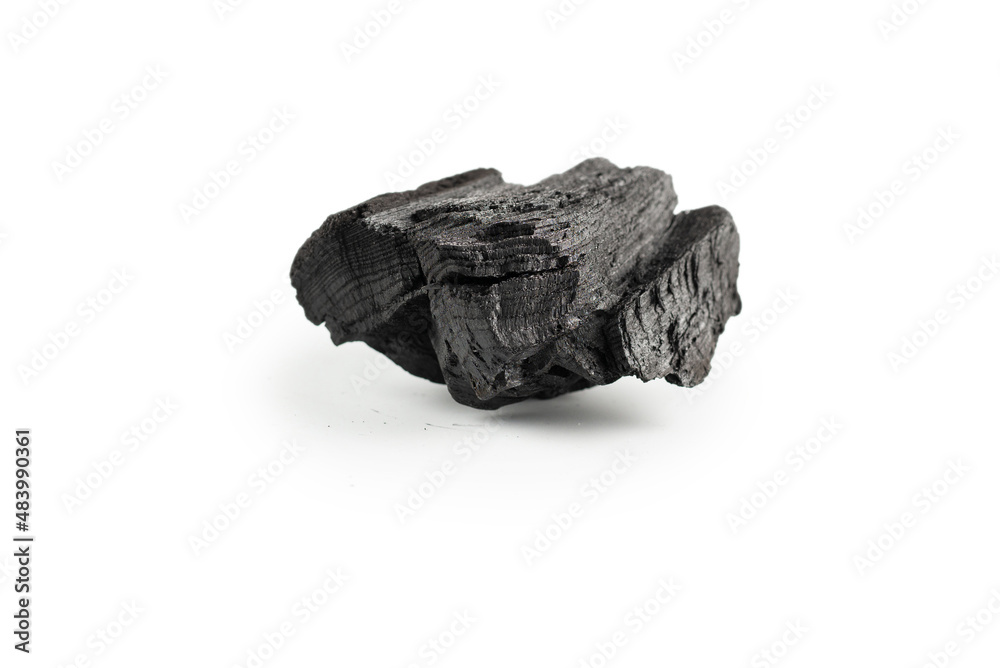 Black oak coal isolated on white background.